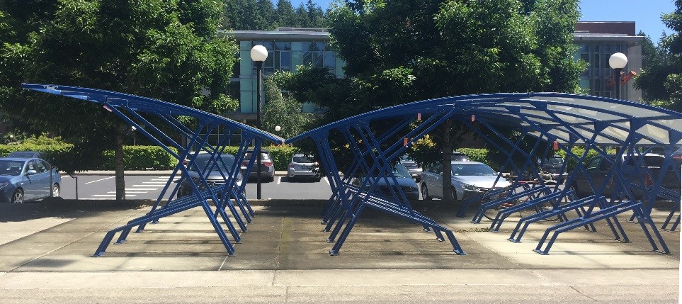 blue metal bike racks with plexiglass roof