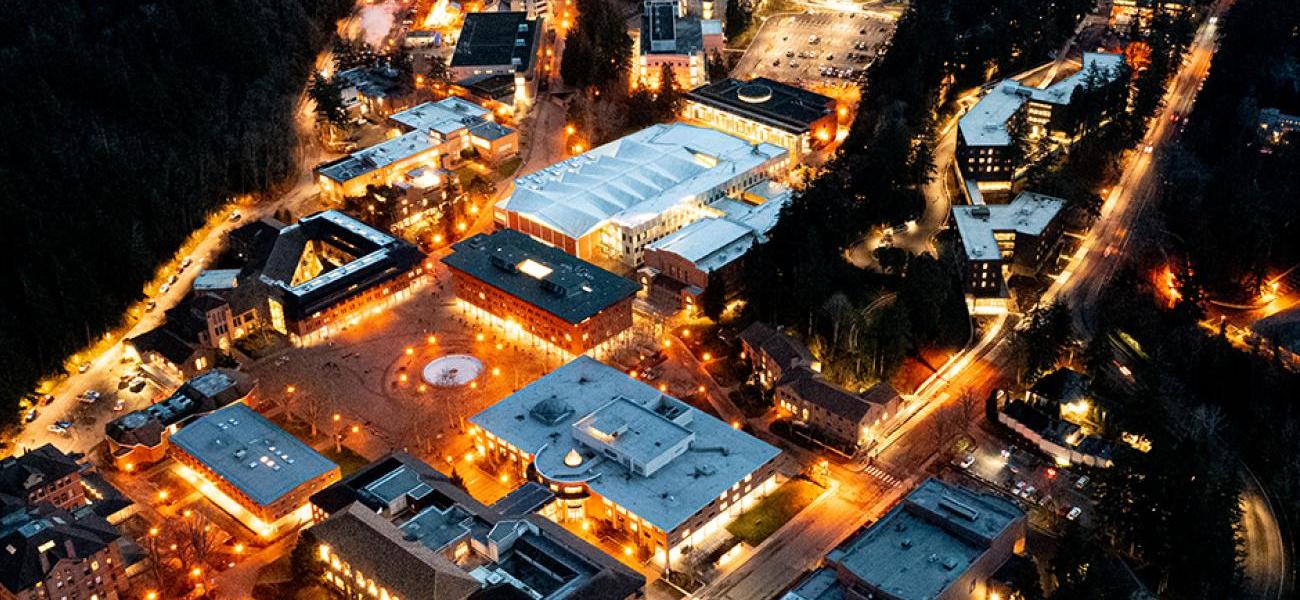 Aerial view of campus lit up at night